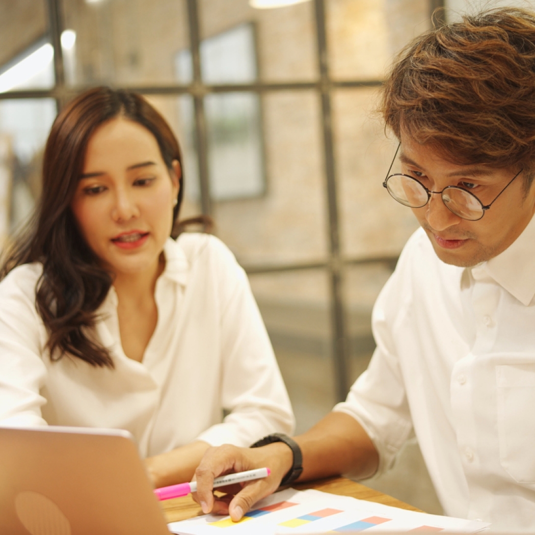 Man and woman reviewing information 